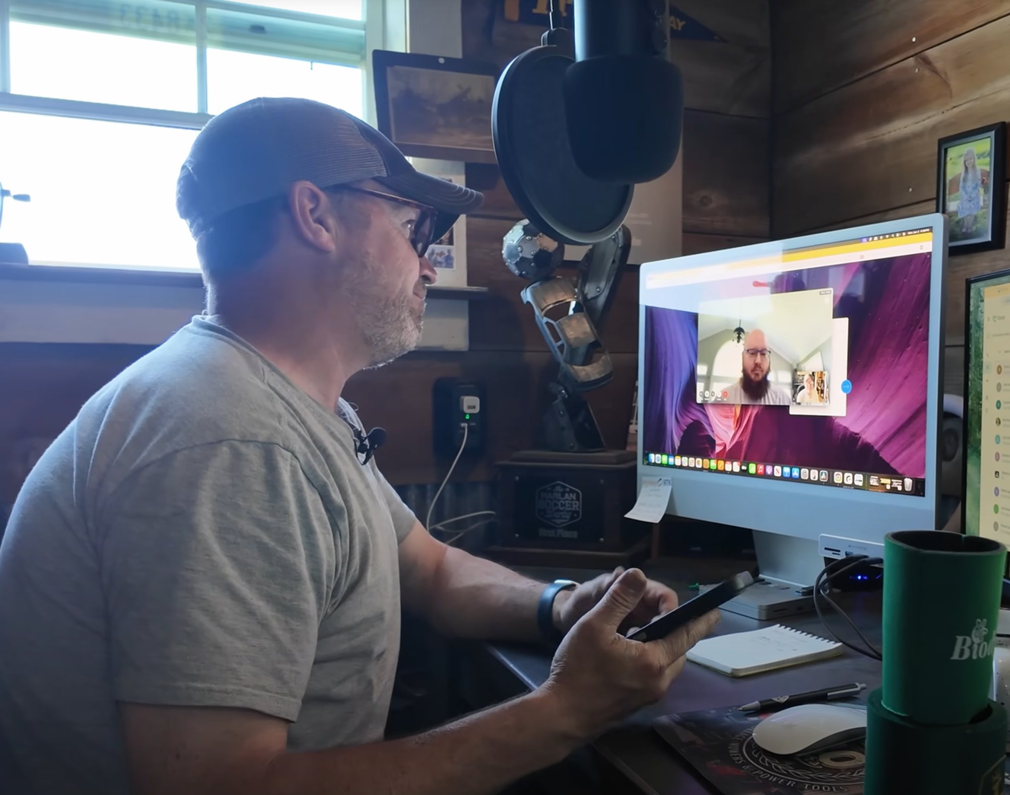 Neil at his iMac on a video call with Patrick configuring the Synology NAS